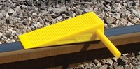 Polyurethane wheel chock placed on railway track – Safetrack rail chock for trains and wagons
